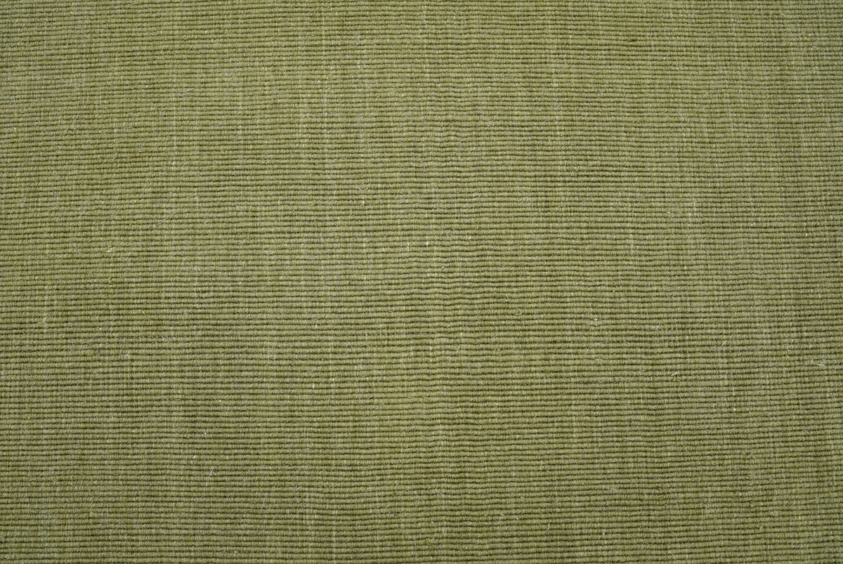 Cabra Wool & Jute Rug in Olive close up, a firm handloom weave of New Zealand wool and jute in a muted green.