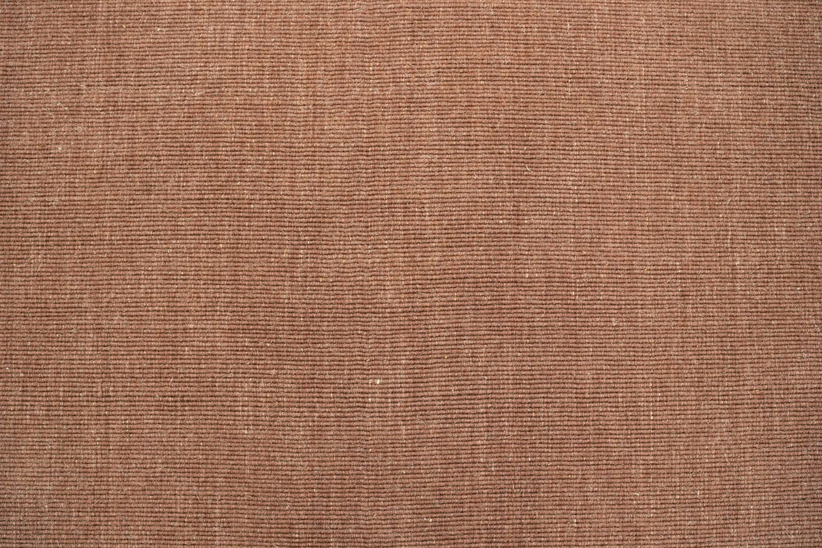 Cabra Wool & Jute Rug in Rust close up, a flat, finely flecked handloom weave of New Zealand wool and jute.