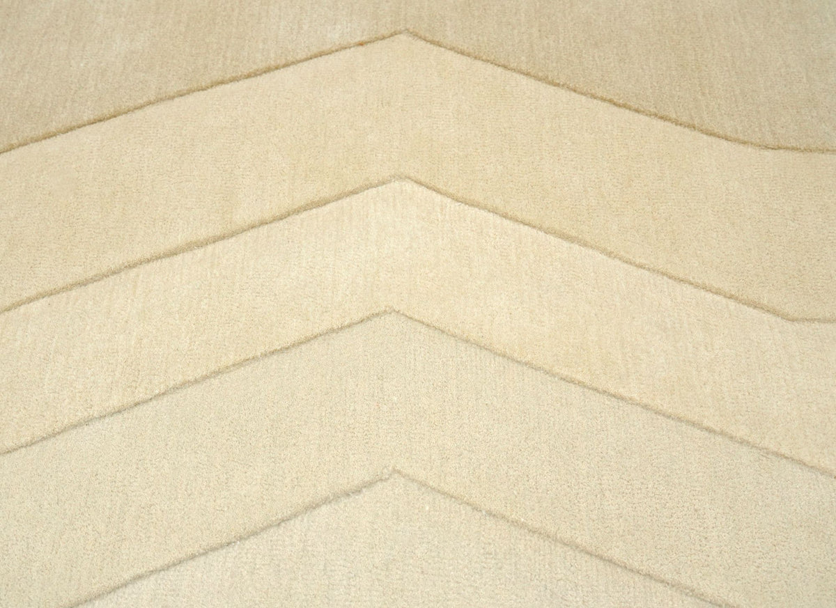 Cadence Wool Rug close up, hand tufted New Zealand wool in stepped ivory bands.