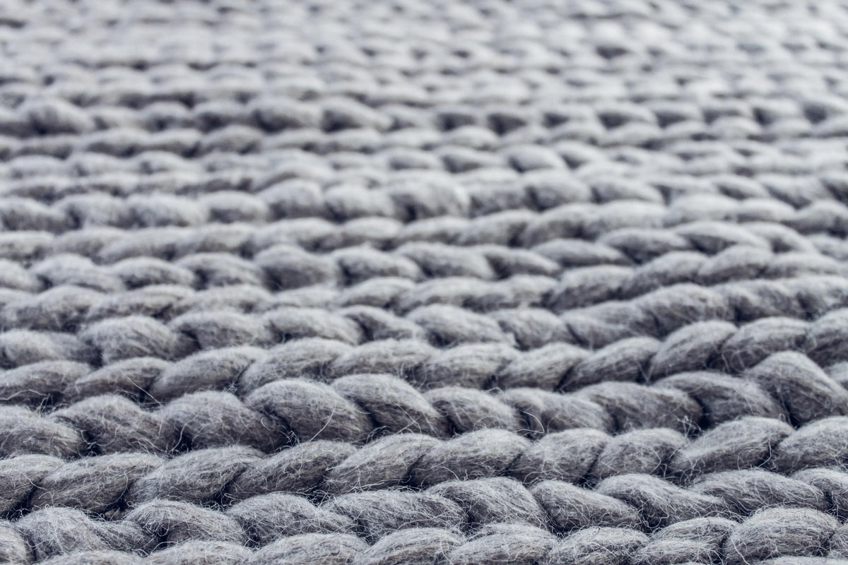 A vacuum cleaner being used on a fine area rug