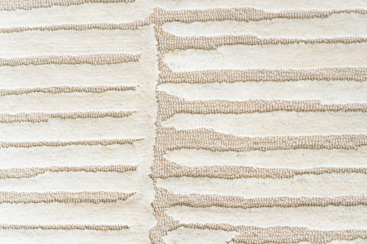 Dune Wool & Silk Rug close up, soft ridged bands of New Zealand wool and Botanical Silk in sand tones.