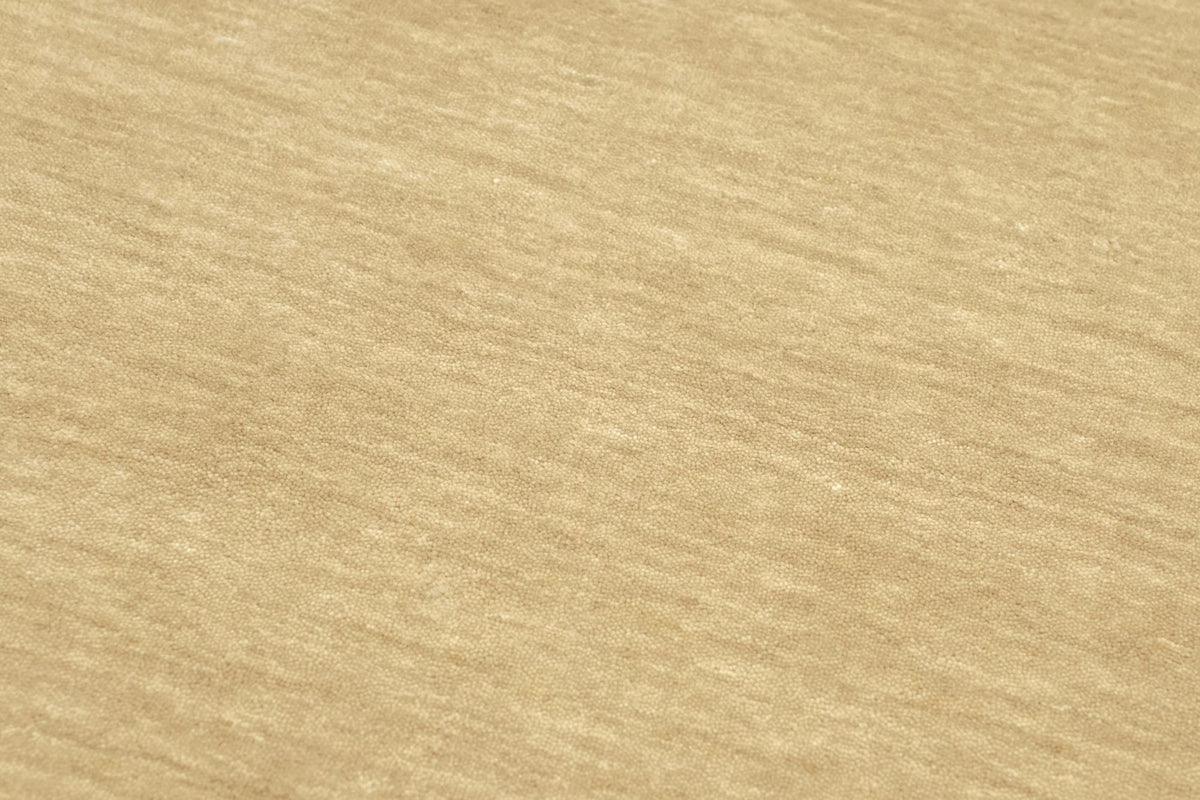 Grain Wool Rug in Sandstone close up, the low, closely worked handloom weave of New Zealand wool.