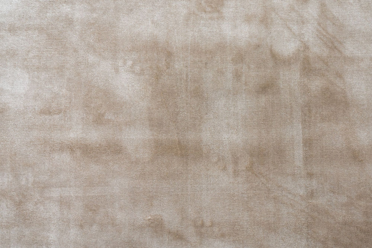 Luma Silk Rug in Greige close up, handloom Botanical Silk with a soft, shifting sheen in warm grey.