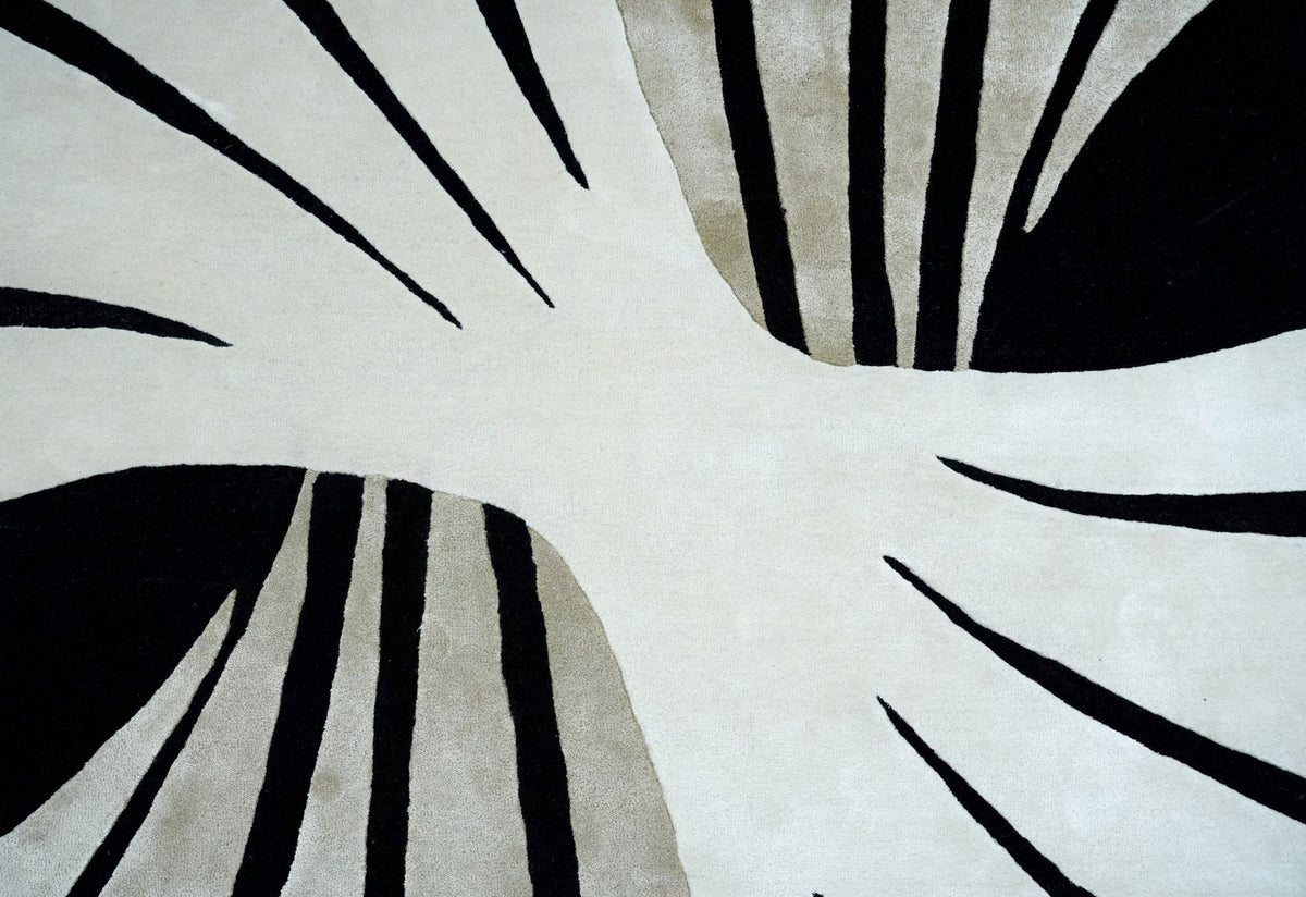 Lyra Wool & Silk Rug close up, ivory, black and pale sage segments fanning out in New Zealand wool and Botanical Silk.