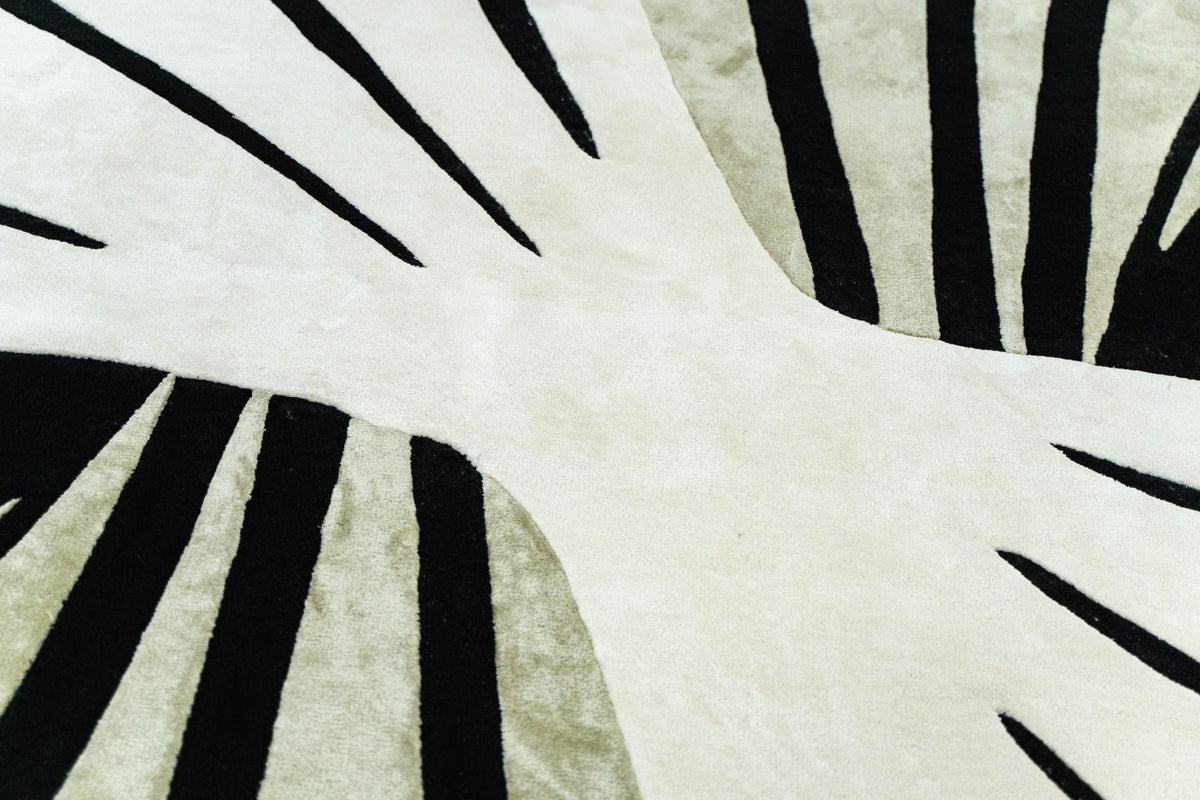 Lyra Wool & Silk Rug close up, ivory New Zealand wool with black lines and pale green Botanical Silk.