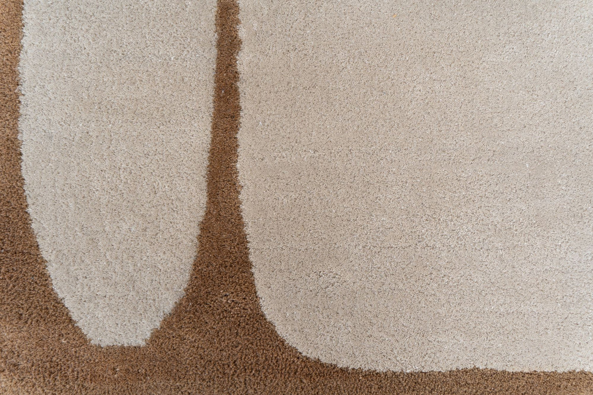 Outline Wool Rug close up, hand tufted New Zealand wool with a camel outline drawn on an ivory field.