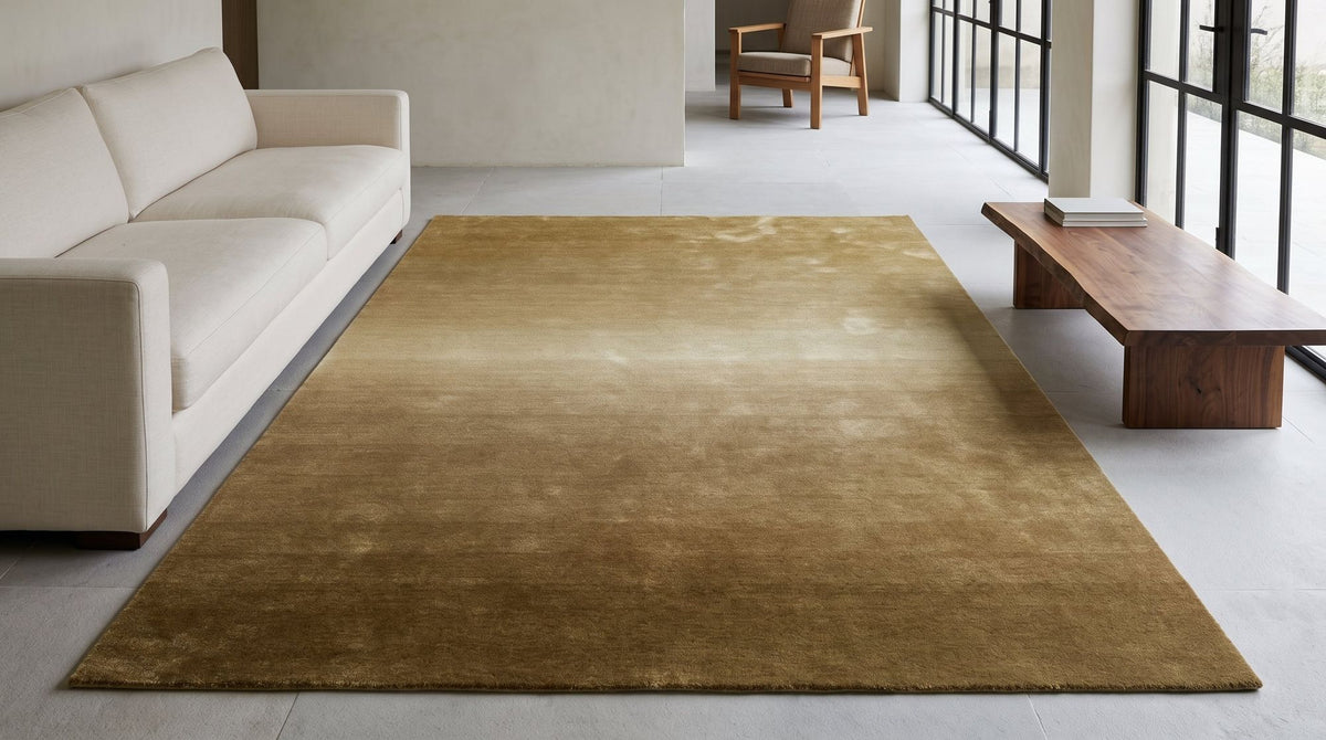 Ombré Dusk Rug in a living room, hand tufted New Zealand wool moving from blue grey to pale sand.