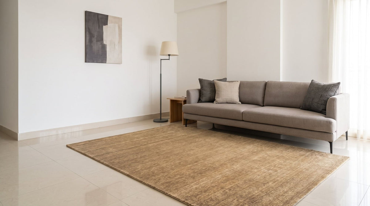 Grain Wool Rug in Tan in a bright, compact Bengaluru living room, handloom New Zealand wool on a pale floor.