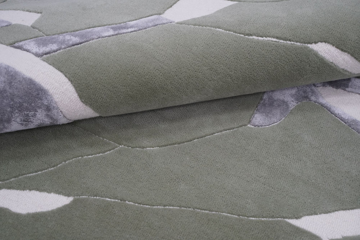Velocity Wool & Silk Rug close up, hand tufted New Zealand wool and Botanical Silk in sage, grey and ivory planes.
