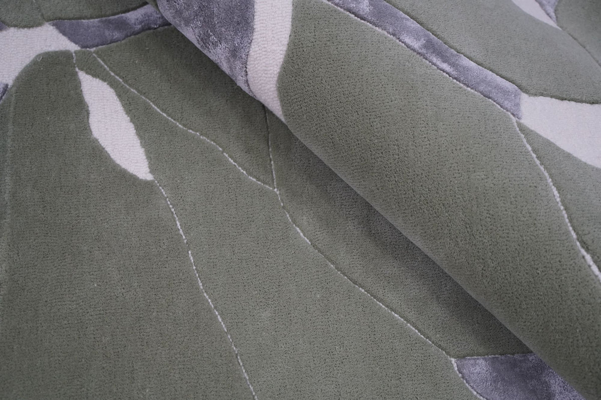 Velocity Wool & Silk Rug close up, hand tufted New Zealand wool and Botanical Silk in sage and grey planes.