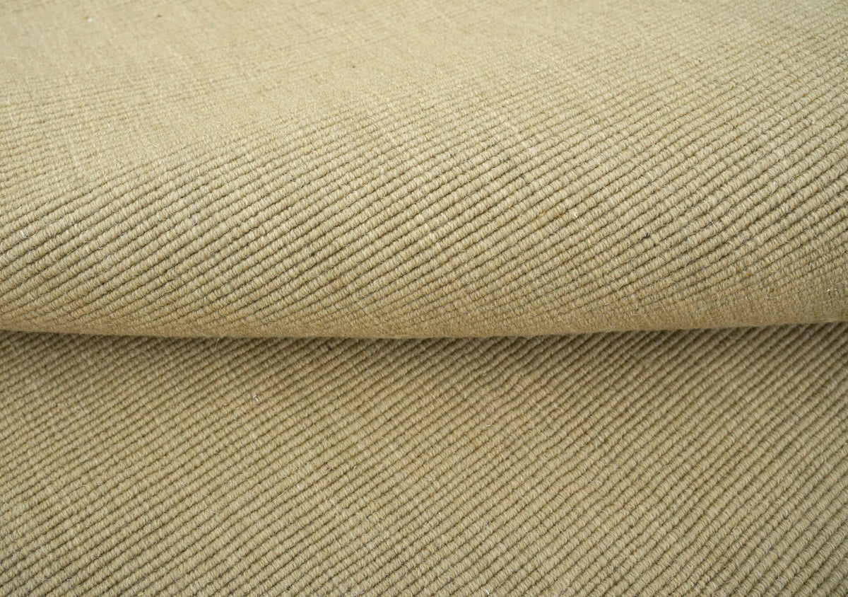 Cabra Wool & Jute Rug in Sand, a firm handloom weave of New Zealand wool and jute at 7 to 8 mm.