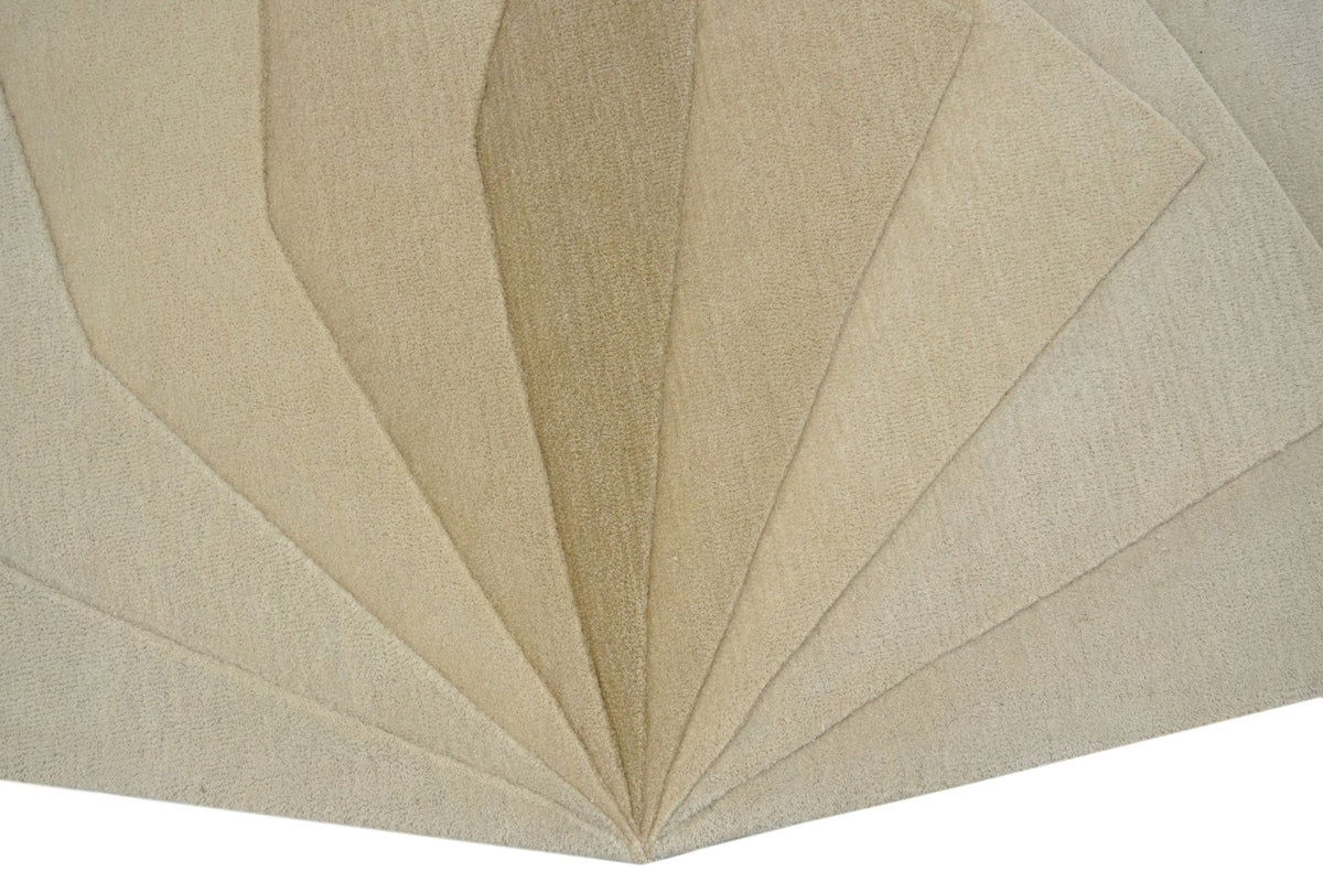 Lucid Wool Rug close up, hand tufted New Zealand wool in ivory and sand planes folding in toward a single point.