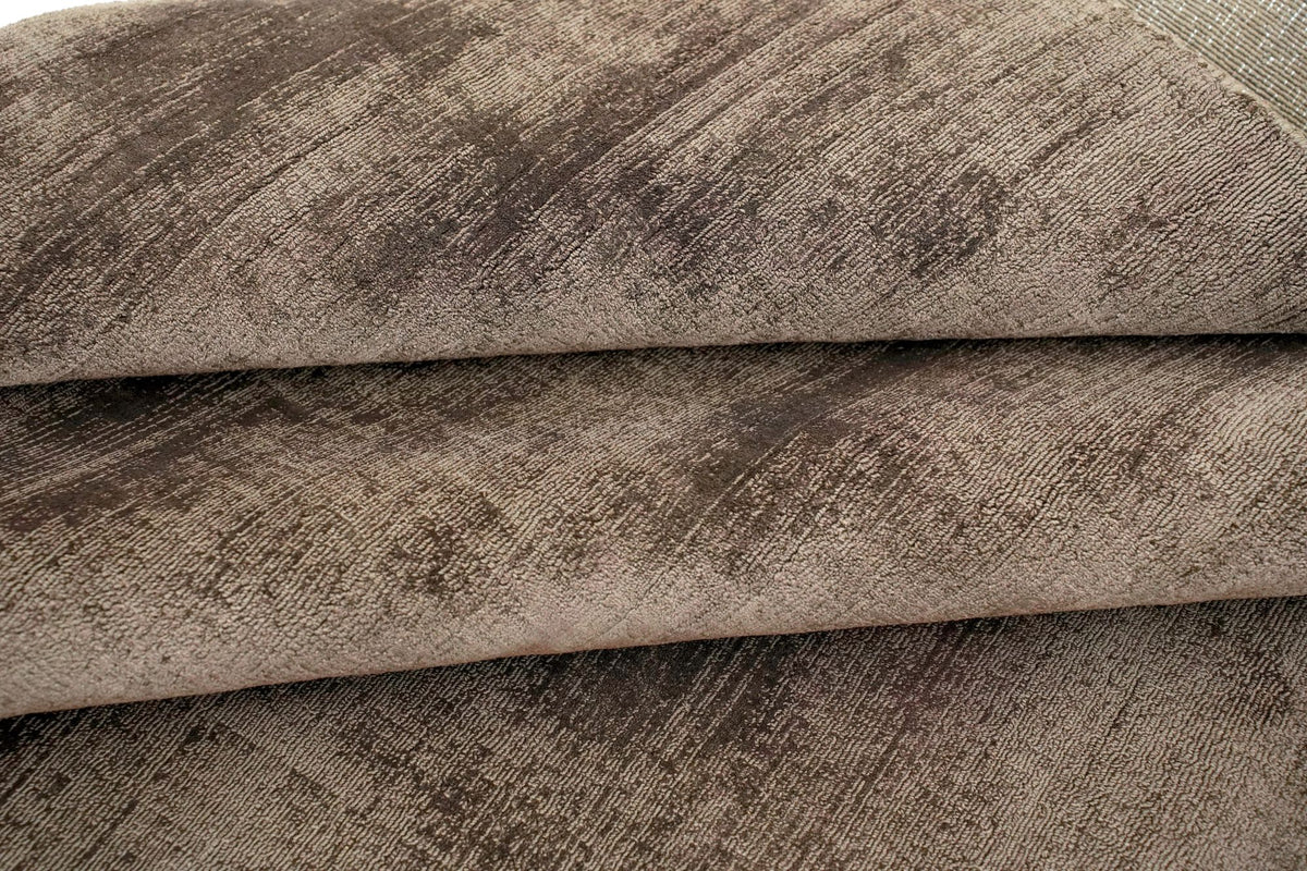 Nuva Silk Rug in Chocolate, handloom Botanical Silk folded, the sheen changing across each fold.