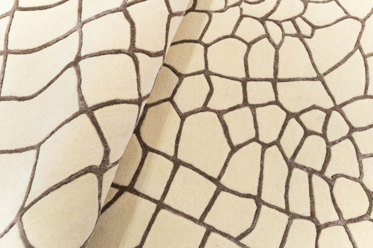 Terraform Wool & Silk Rug folded in soft waves, ivory cells outlined in brown, hand tufted wool and silk.