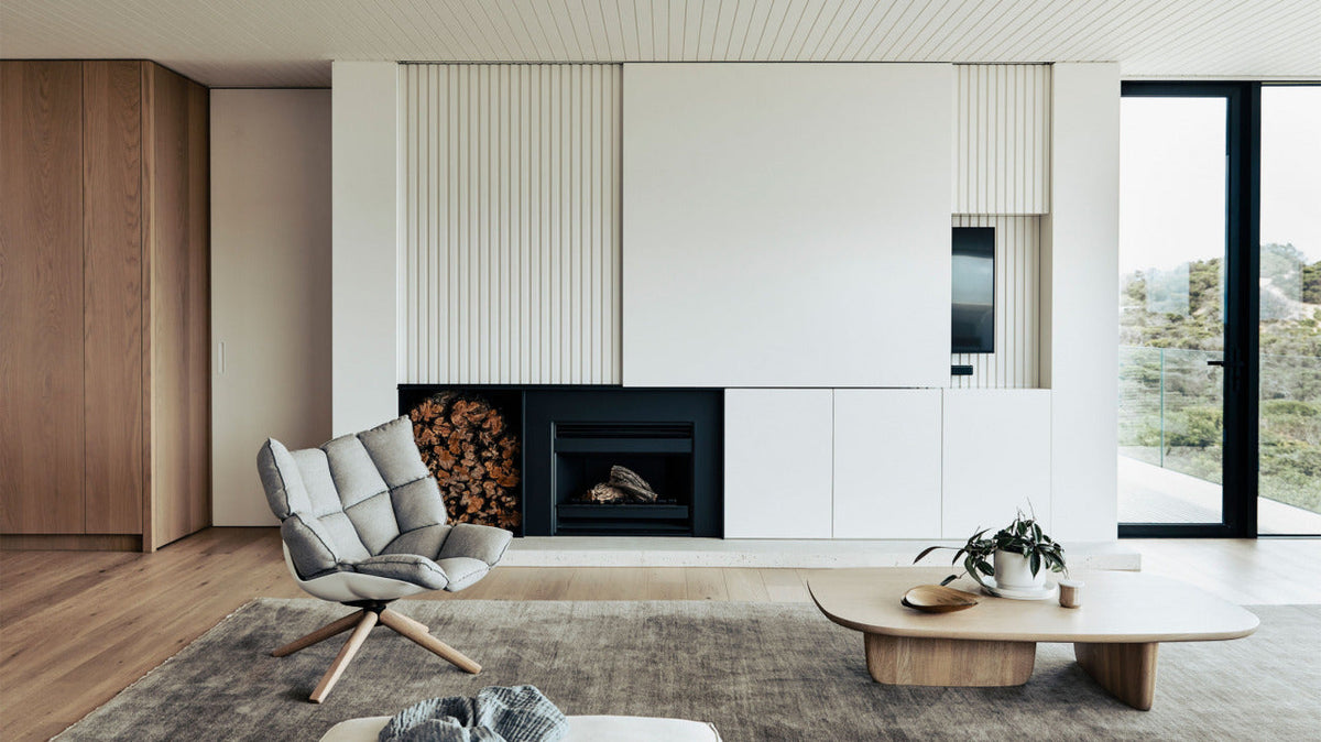 A patterned rug placed beneath furniture in a styled living room