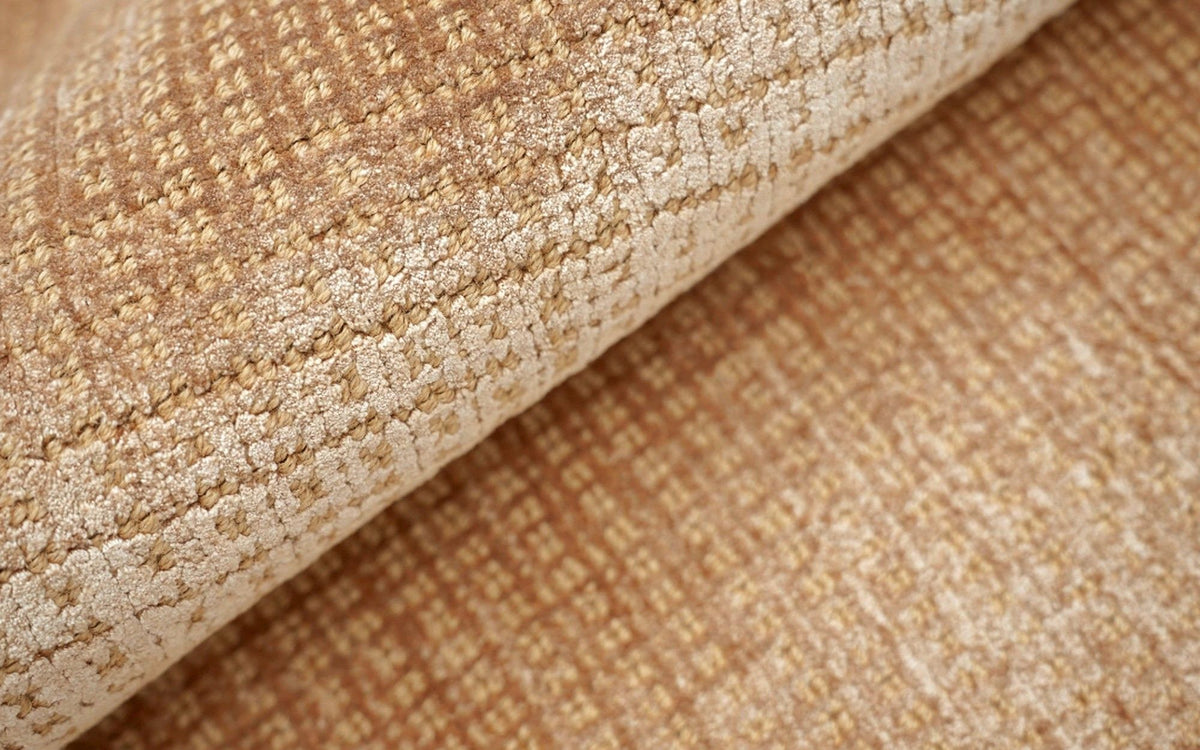 Meraki Jute & Silk Rug in Caramel folded, handloom jute with fine threads of Botanical Silk.