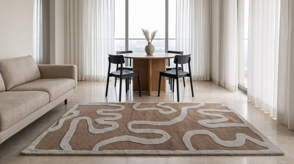 Congrand Wool Rug in a living room, sized so the front legs of the sofa and chairs stand on it.