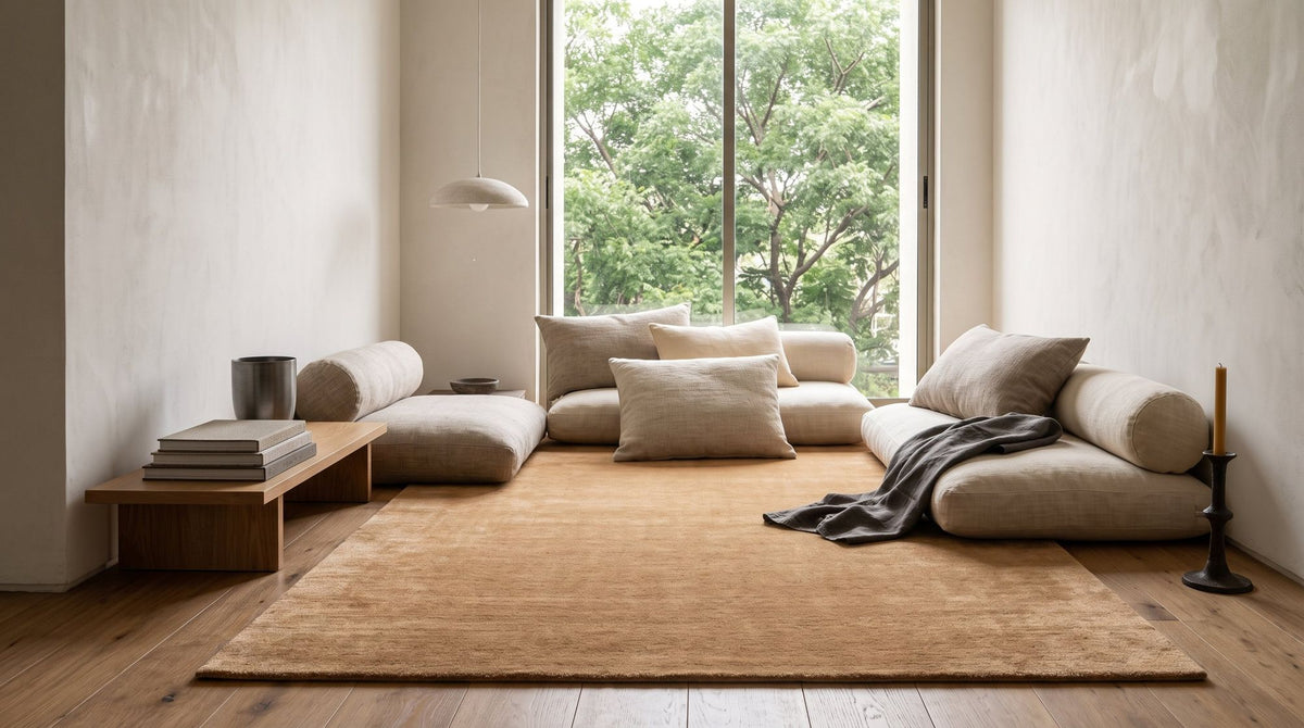 Plush Wool Rug in Camel under floor cushions in a styled sitting room, handloom New Zealand wool with a deep pile.