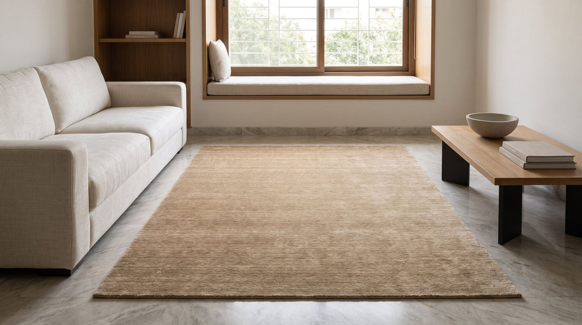 Grain Wool Rug in Tan in a calm living room with a window seat, handloom New Zealand wool in a warm mid tone.