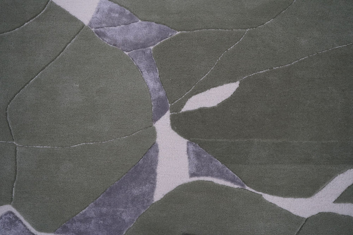 Velocity Wool & Silk Rug close up, sage New Zealand wool with grey Botanical Silk shapes and ivory outlines.