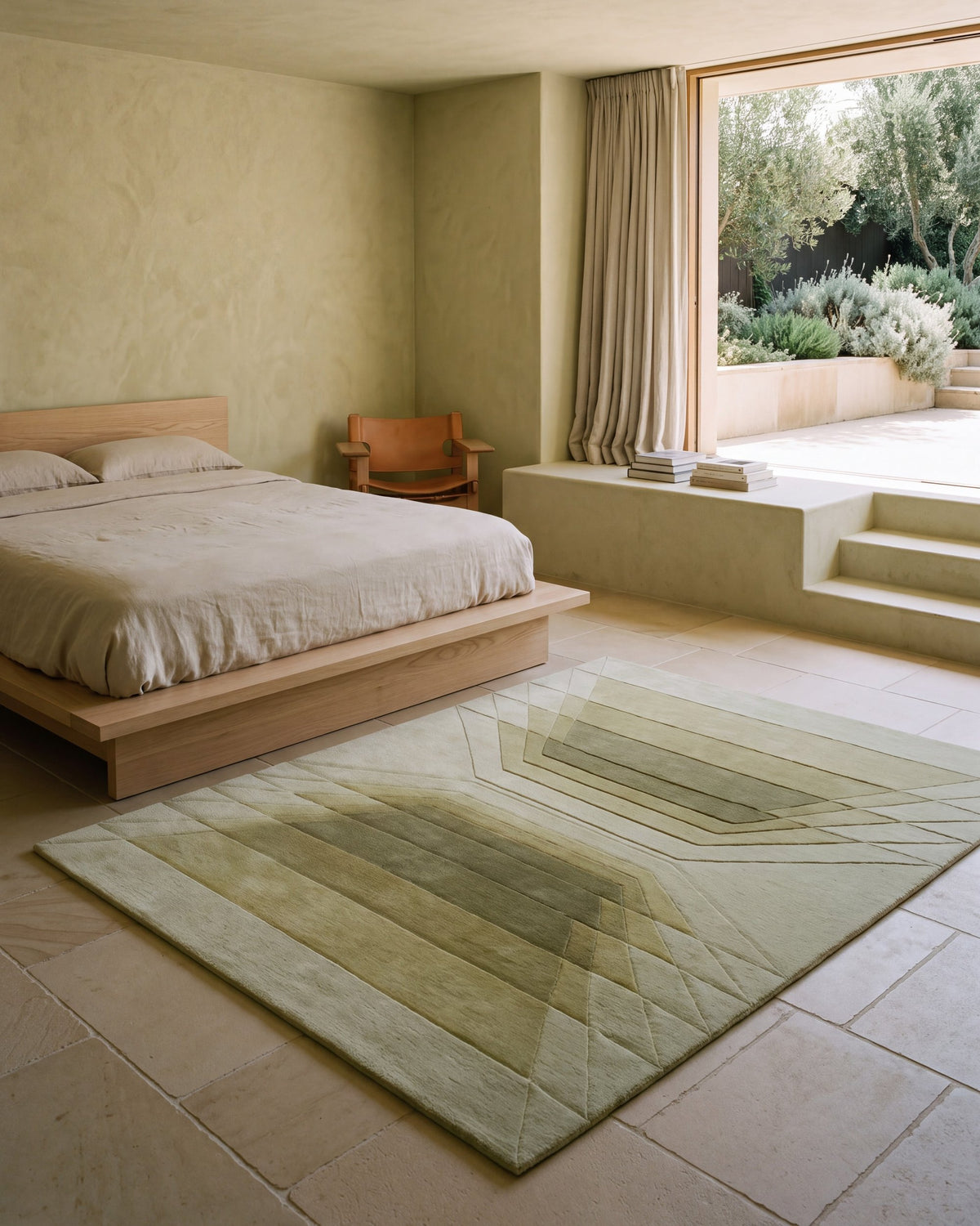 Cavea rug at the foot of a bed