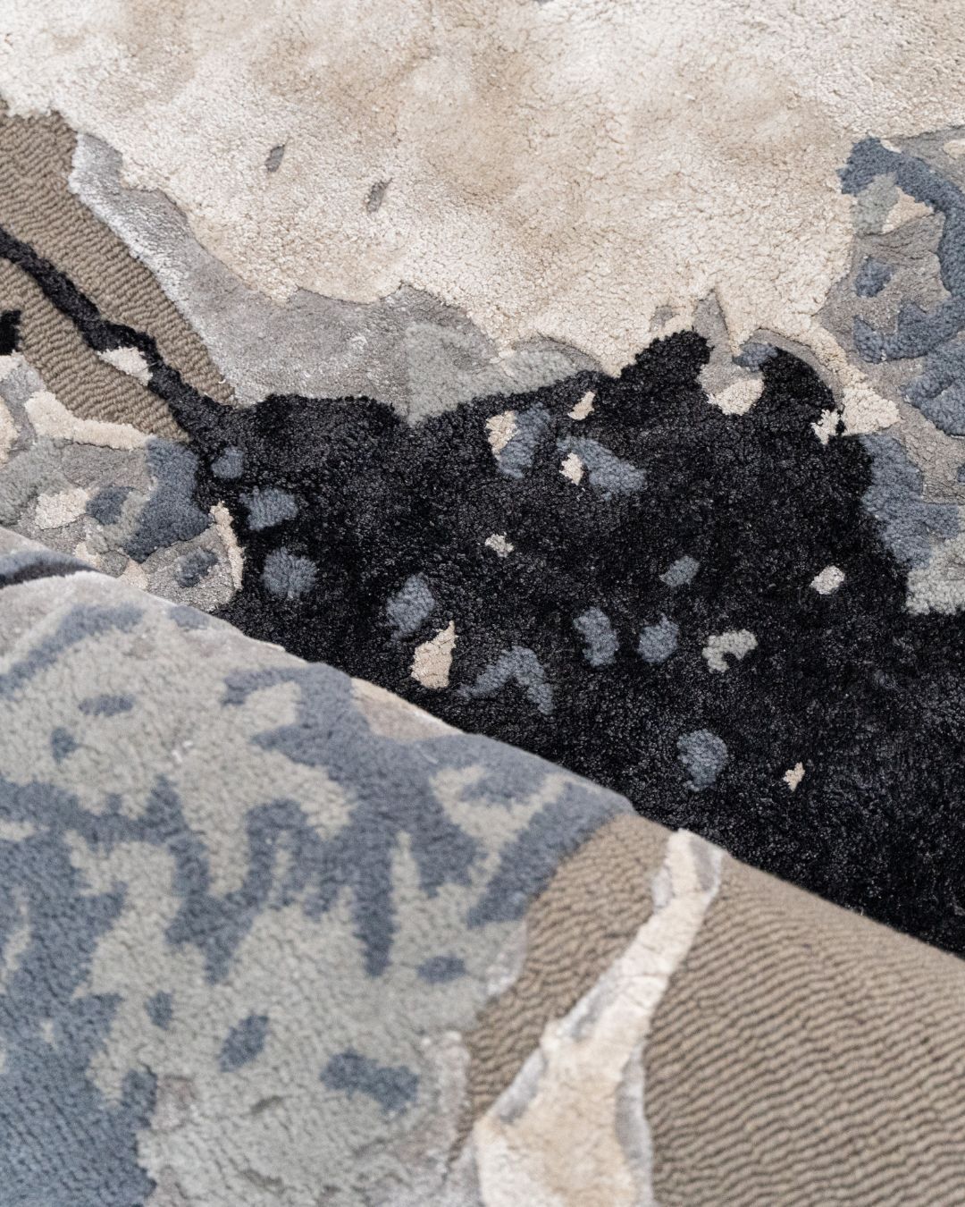 Close-up of the Nebula Wool & Silk Rug, highlighting the hand-tufted wool base and soft silk patterns.