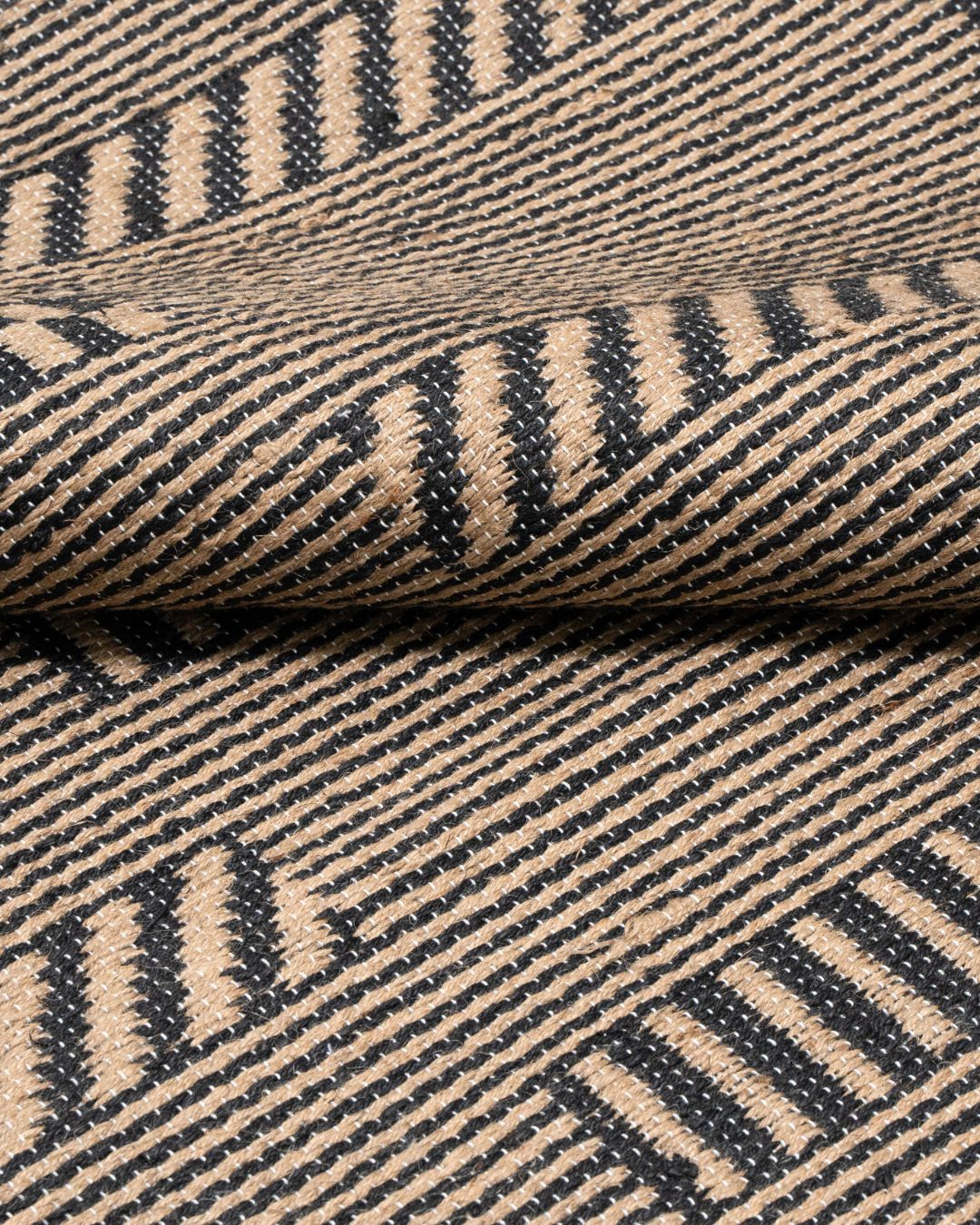 Close-up of Pampas Jute Rug showcasing handwoven textures and natural jute fibers for an eco-luxury touch.